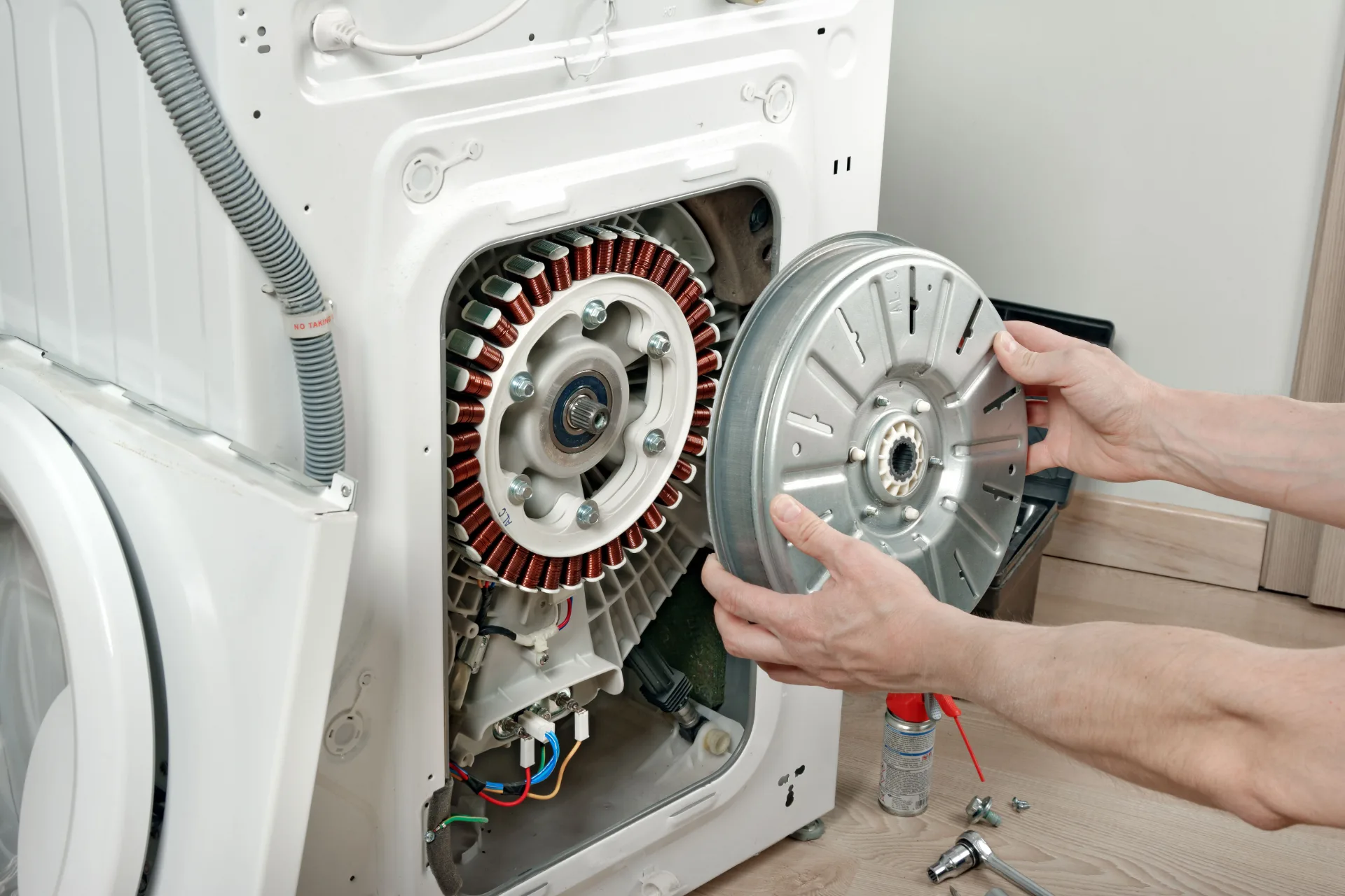 Bayside Appliance Services Technician Repairing Appliance